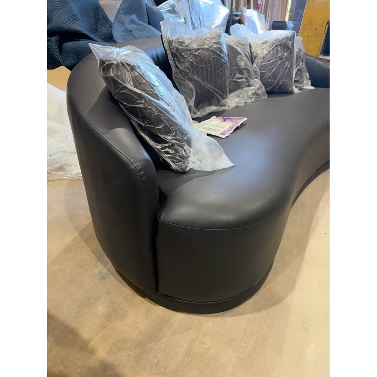 New 91” Curved Faux Leather Sofa – Dark Gray – $1,499 Retail – Delivery Available
