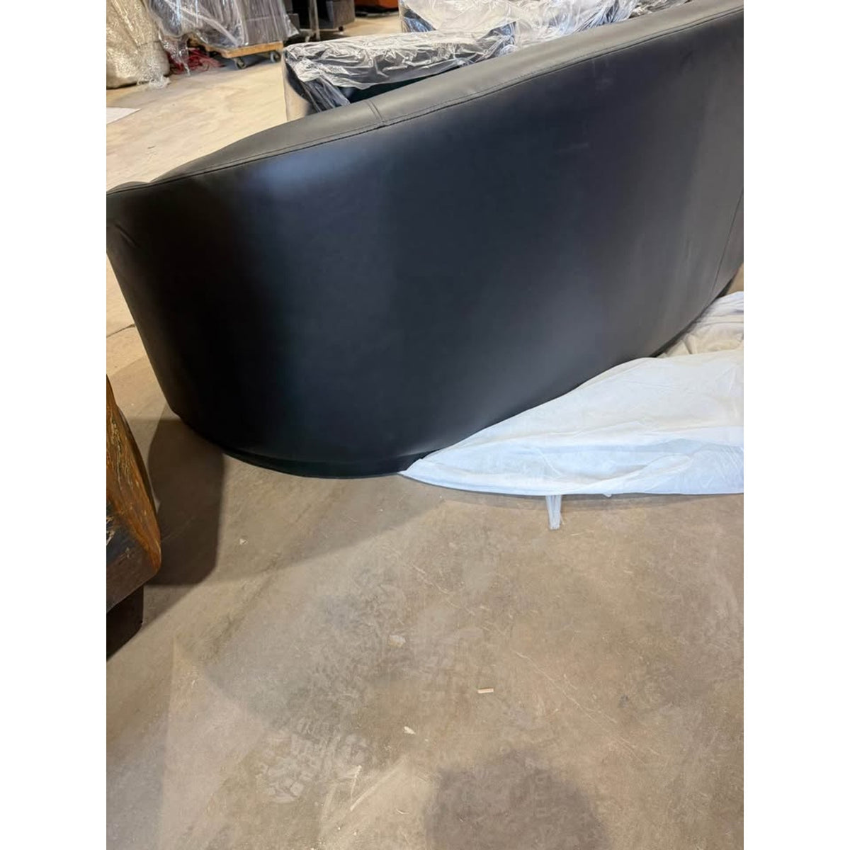 New 91” Curved Faux Leather Sofa – Dark Gray – $1,499 Retail – Delivery Available