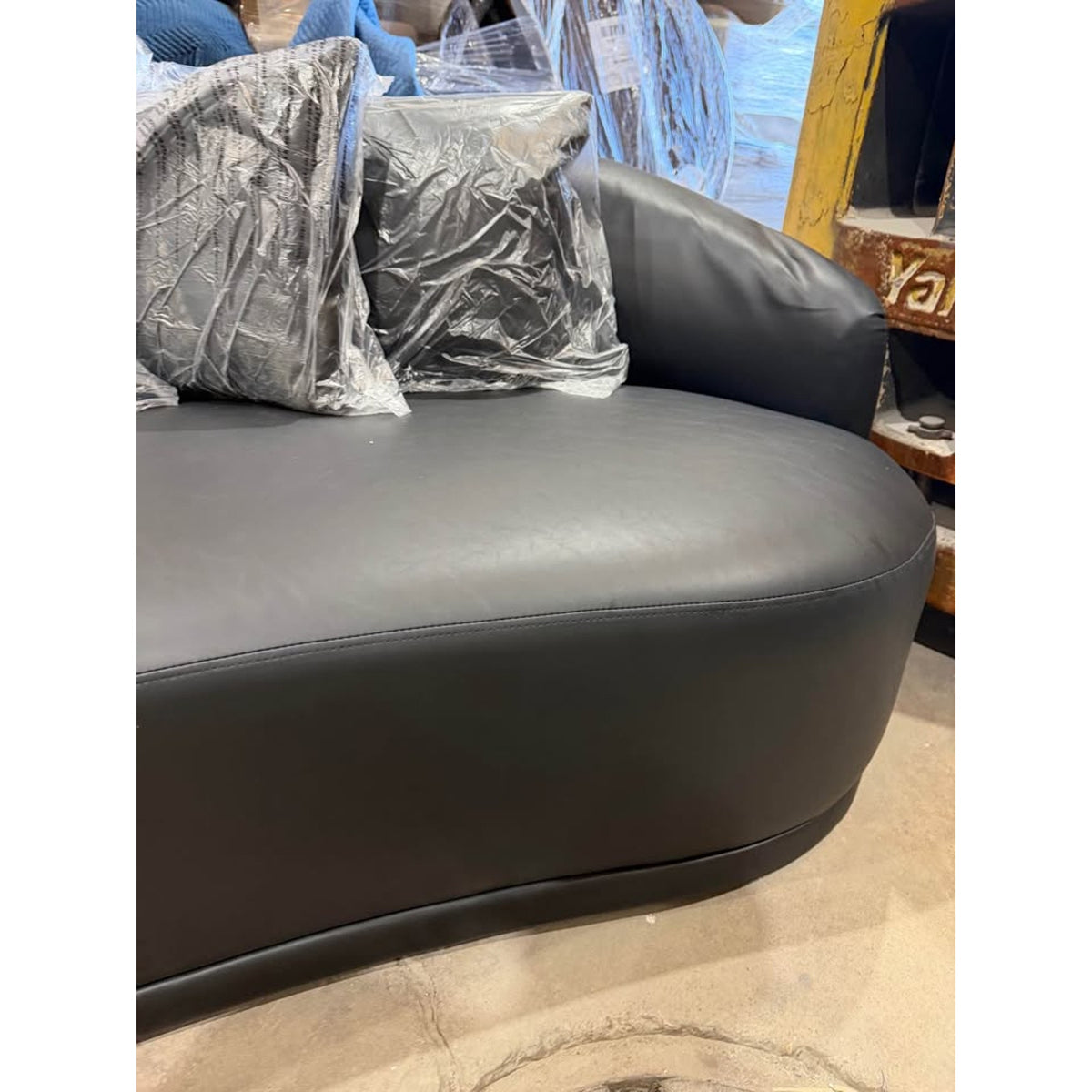New 91” Curved Faux Leather Sofa – Dark Gray – $1,499 Retail – Delivery Available
